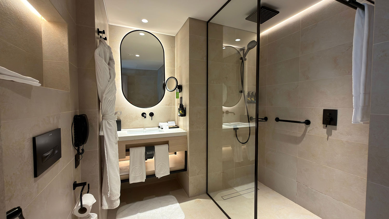 A renovated bathroom with a walk-in shower